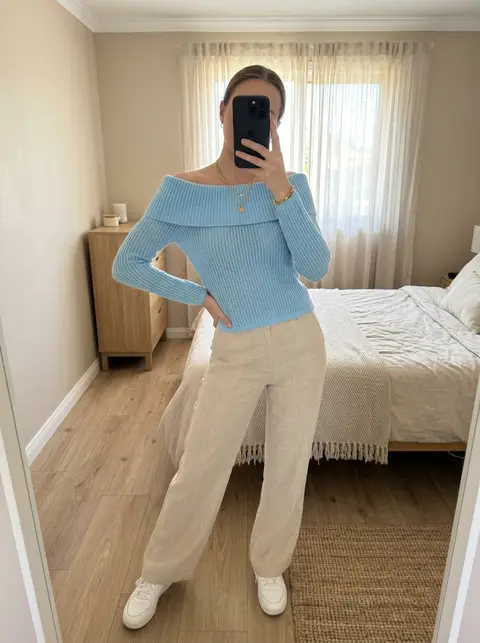 The same light blue off-shoulder knit jumper, shown on a model