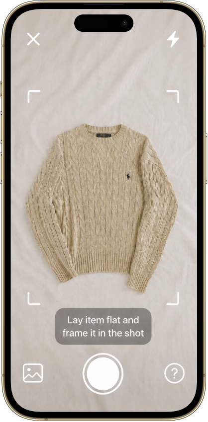 The Vintsnap camera framing a knit sweater laid flat to photograph